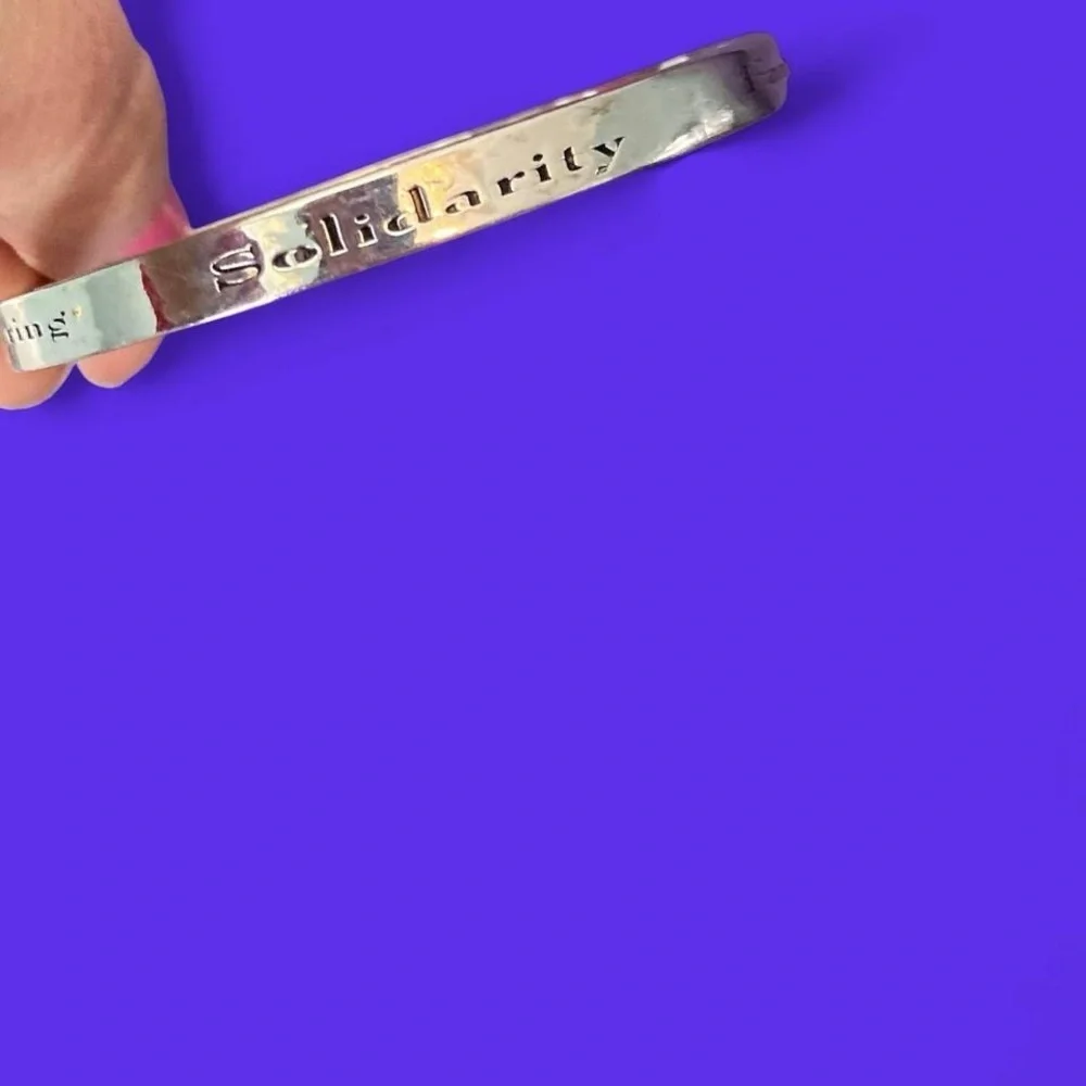 Silver tone family, solidarity, truth etc bracelet